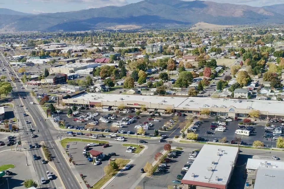 Aerial view of midtown Missoula, Montana with mountains in background